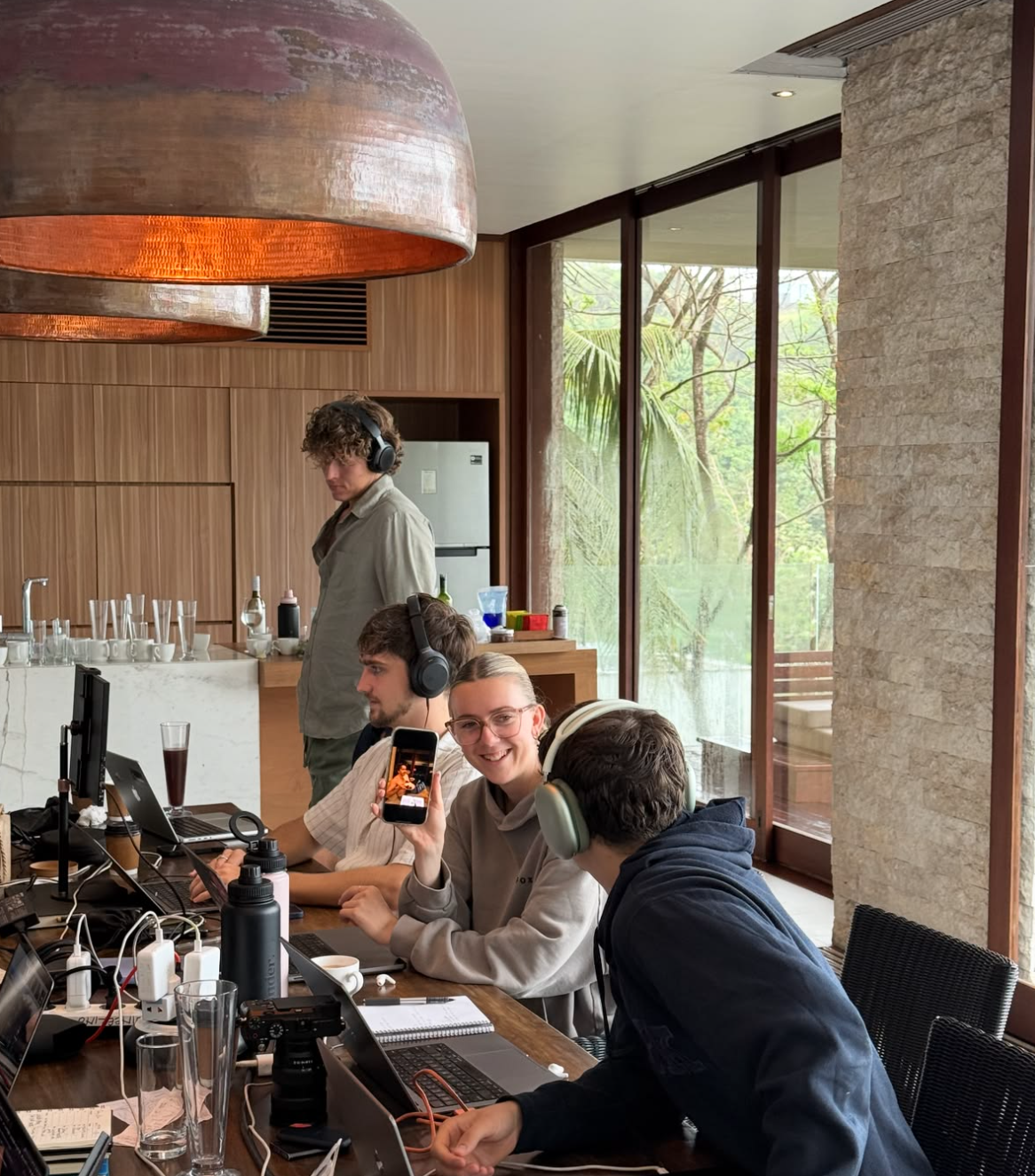 A team working together around a table in a bright lounge